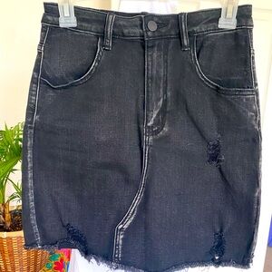 Stretchy denim small black skirt. Never worn !